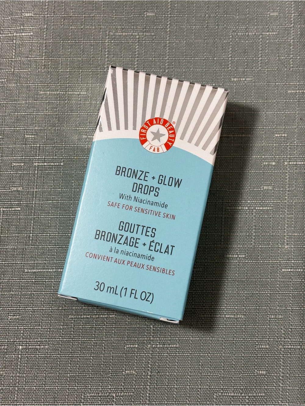 First Aid Beauty Turquoise and White Striped Cosmetic Box